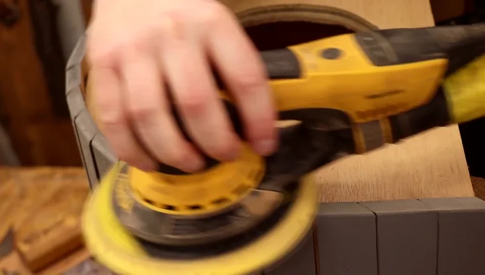 Sand and smooth the entrance hole; use an electric felt file for the inside of the hole. Paint the inside of the cat houses.