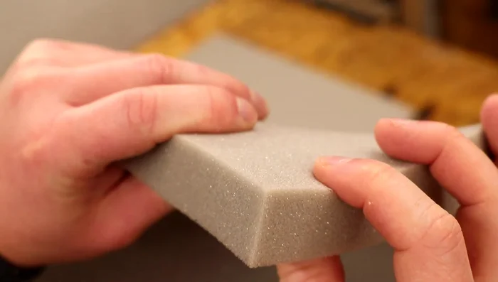 Make cushions from foam, cut using a bandsaw (or sharp knife), and cover them with fabric using hot glue. 