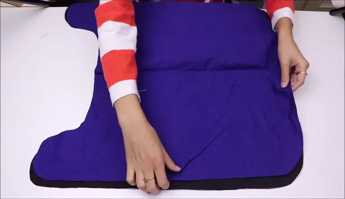 Assemble the coat body: Layer outer fabric (right side up), lining (right side up), and wadding (on top of lining). Sew around, leaving an 8cm gap for turning.