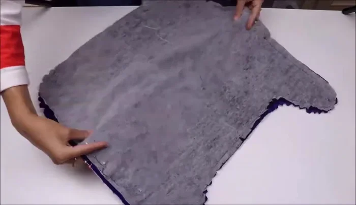 Turn right side out: Turn the coat right side out through the gap, using tools to push out corners. Press seams.