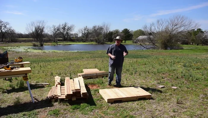 Assemble the base: Attach the legs to the base using glue and nails, ensuring level placement using a level. Only use one nail initially for flexibility during leveling.