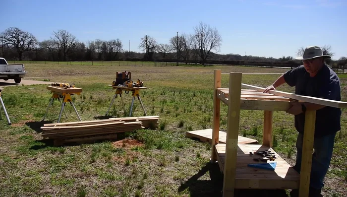 Attach roof boards: Cut side boards to fit against the roof supports. Ensure they're flush with the sides of the roof structure. Then, install the roof boards, ensuring a proper overhang (about 6 inches).