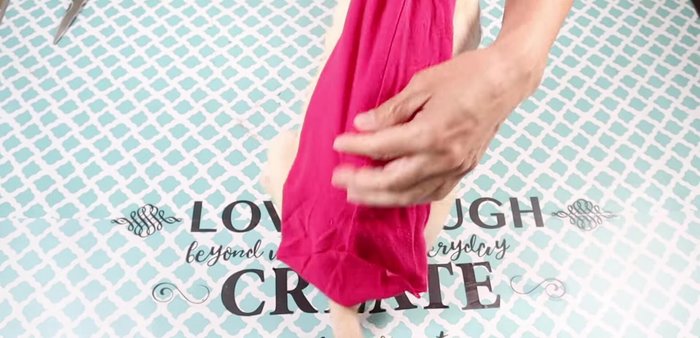 Measure and cut the sleeve to fit your pet's back, ensuring the stitching is on the underside.