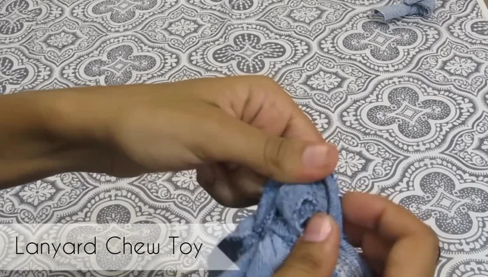 Remove the rubber band and tie off the end. Repeat until you have a desired length of braided fabric.