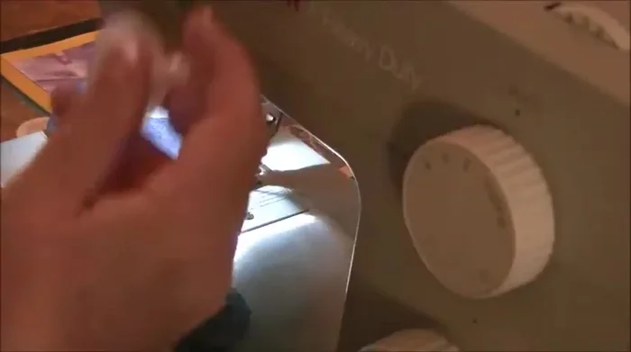 Stuff the toy with filling, placing the squeaker inside with some padding around it for protection.