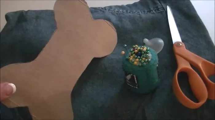 Cut out your desired dog toy shape from cardboard. Use this as a template.