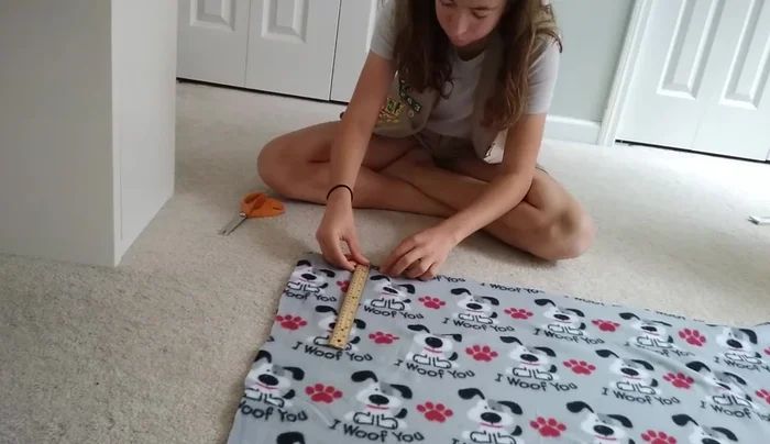 Cut off the corners of both felt pieces (5 inches by 5 inches).