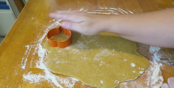 Use a pumpkin-shaped cookie cutter to cut out the treats. Reroll scraps and continue until all dough is used.