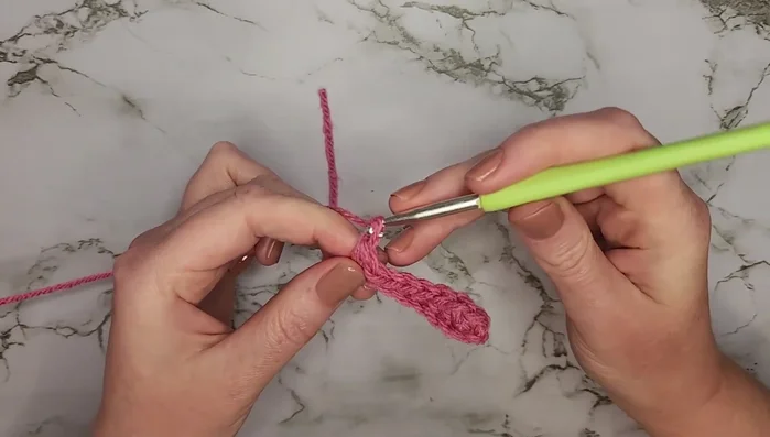 Chain one, turn, and single crochet into the back loop only for eight stitches. Repeat this row until you reach row 48.