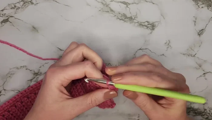 Row 7: 58 half double crochets across.