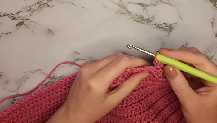 Row 28: Decrease every other row by half double crocheting two stitches together at the beginning and end of the row. Repeat this decrease every other row (rows 30, 32, 34) until row 35 with 36 stitches.