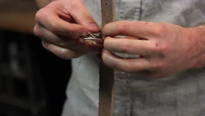 Dry fit the buckle and all components before setting the rivets to ensure proper placement.