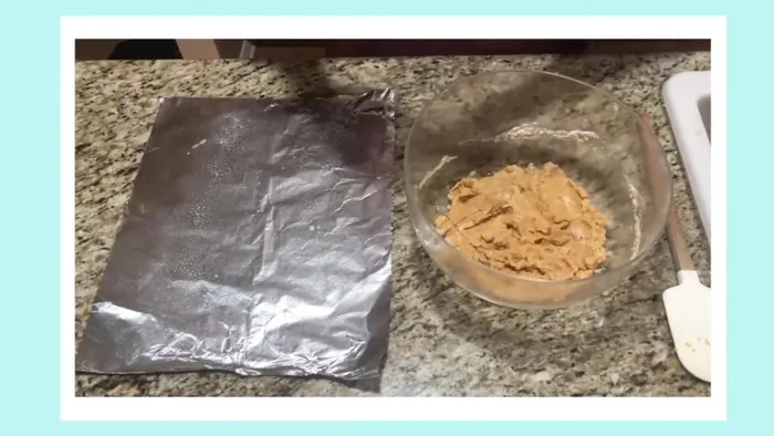 Form and bake cat treats: Roll the dough into small balls, flatten slightly with a fork, and bake at 350°F (175°C) until golden brown.