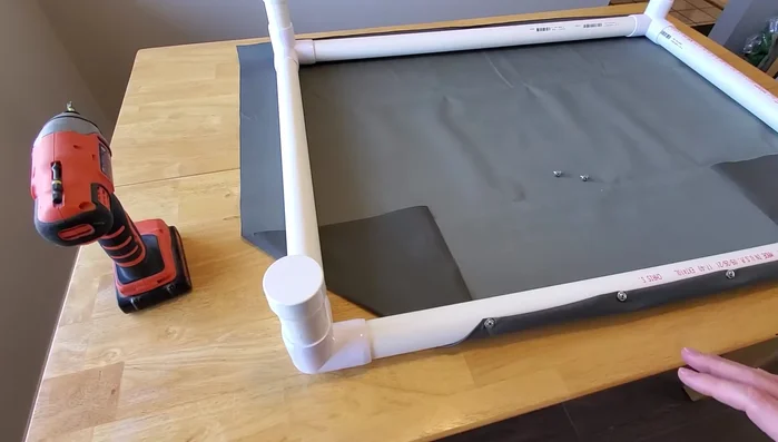 Fold and secure the corners: Carefully fold and secure each corner around the fittings.