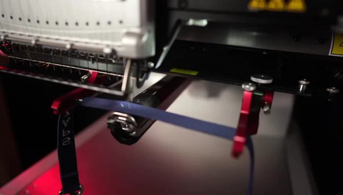 For the collar, set up the design horizontally. Double-check placement before embroidering.