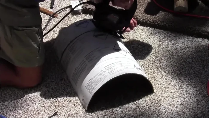 Attach carpet padding and carpet to the bottom of the round bed using staples and glue.