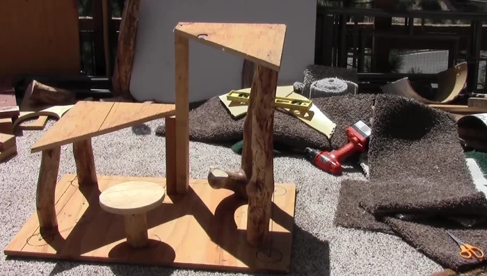 Cut the legs of the cat tree (one side 12 inches, the other 12 1/4 inches).