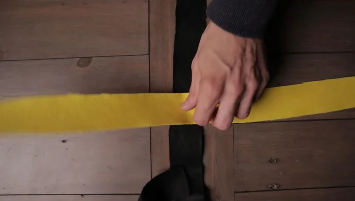 Begin by folding clockwise, similar to the simple spiral. Tuck the final strip underneath the first to create the hole, then gently tighten the first few folds.