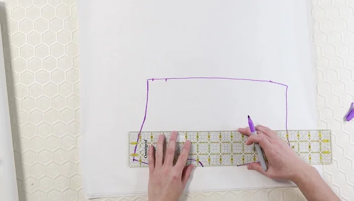 Double-check pattern accuracy by laying the sweater onto the pattern.