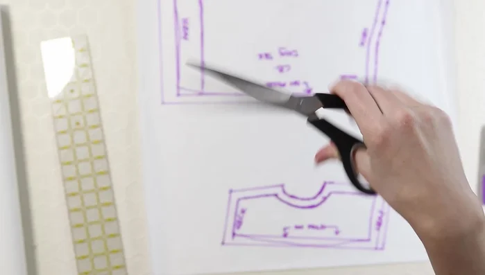 Double-check pattern accuracy by laying the sweater onto the pattern.