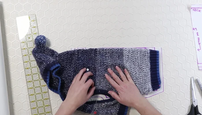 Double-check pattern accuracy by laying the sweater onto the pattern.