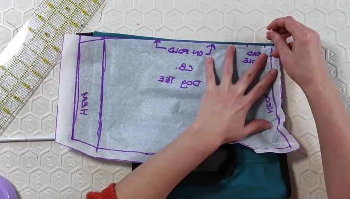 Make alterations to the pattern based on the first fitting (take in the back, add darts if needed).