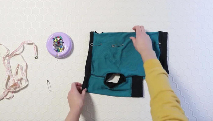 Make alterations to the pattern based on the first fitting (take in the back, add darts if needed).