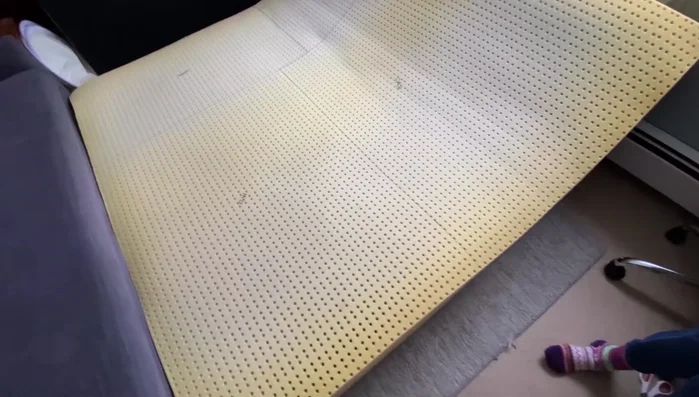 Measure and draw lines for your desired dog bed sizes using a tape measure and Sharpie.