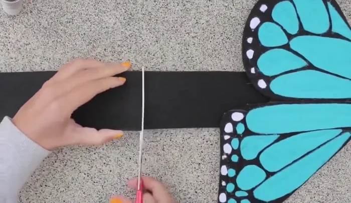 Measure and cut the body band to fit the dog, and glue ribbon to each end for tying.