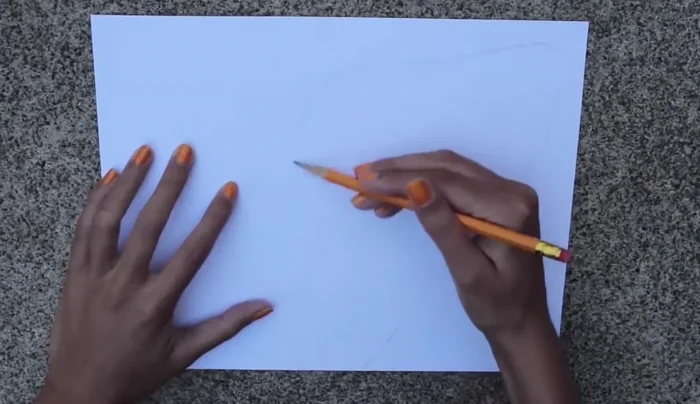 Cut small circle pieces from felt and glue them onto the wing to create a pattern; repeat with white felt.