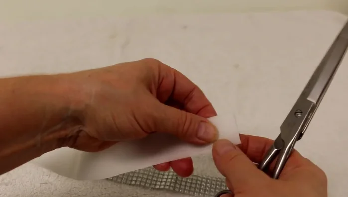 Apply hot glue to the other side of the Velcro and attach it to the other end of the collar, ensuring the collar lies flat. Allow to dry completely.