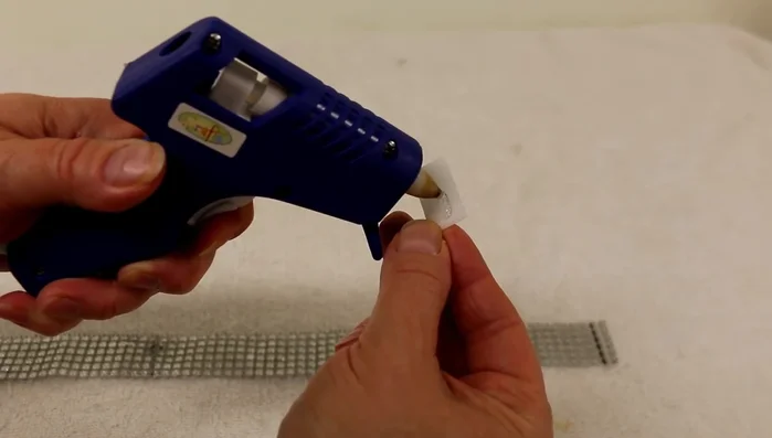 Apply hot glue to the other side of the Velcro and attach it to the other end of the collar, ensuring the collar lies flat. Allow to dry completely.