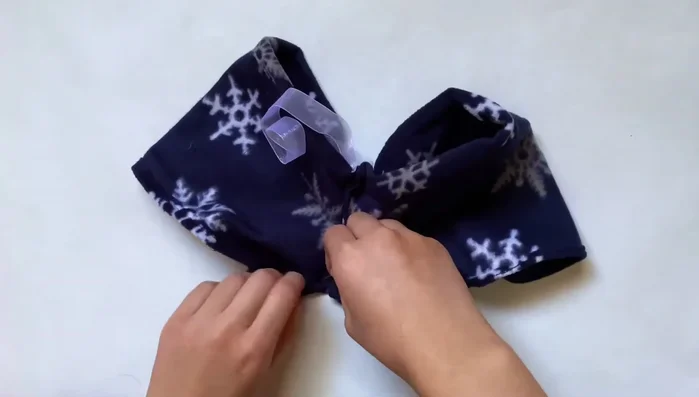 Close the legs: Pin and sew the remaining open side of the pants closed.