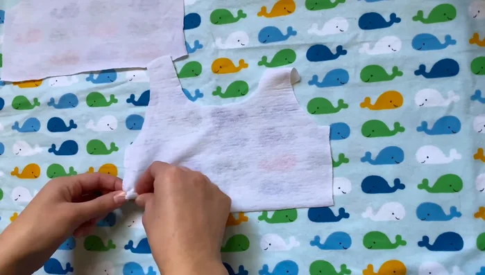 Close sides and sleeves: Sew the side seams of the shirt, attaching sleeves along the bottom seams of the shirt.