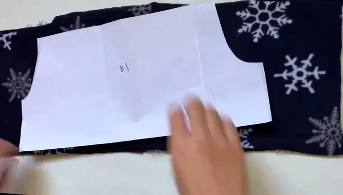 Cut out pants pieces: Using snowflake fabric, cut two mirrored rectangles based on your pattern.