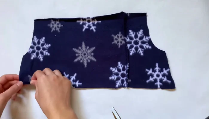 Attach ribbon: Measure ribbon length by wrapping around your stuffed animal, tie a bow, and attach to openings with safety pins.