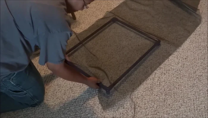 Measure and cut the mesh: Measure approximately one inch from the sewn edge and cut the mesh to size. The exact measurement is not critical.