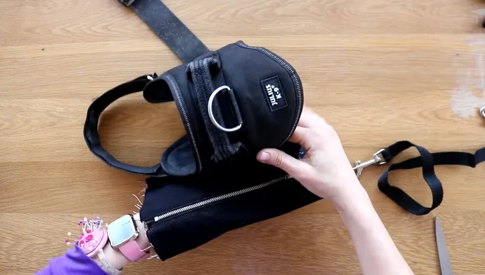 Pin and sew the dog lead to the center, leaving an inch overhang.