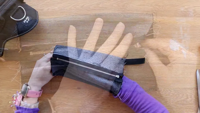 Pin and sew the dog lead to the center, leaving an inch overhang.