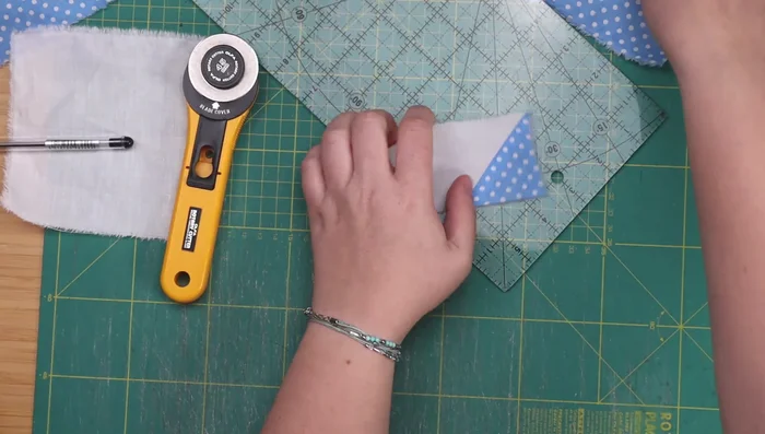 Attach the ears to the cat's head.