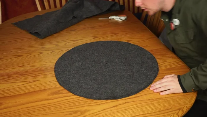 Cut a slice out of the remaining felt to create a slope for the hat brim. Try it on and adjust until it fits snugly.