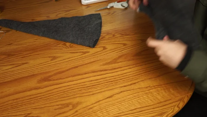 Pin the cone to the brim, matching seams, and sew around the edge to attach the cone to the brim.