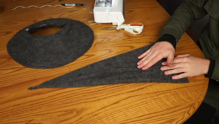 Pin the cone to the brim, matching seams, and sew around the edge to attach the cone to the brim.