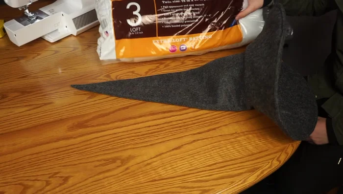 Pinch the point of the hat with needle and thread to create a nice arch.