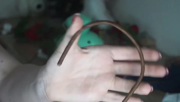 Secure the wire crown to a heavy object (like a candle holder) to make it easier to work with.