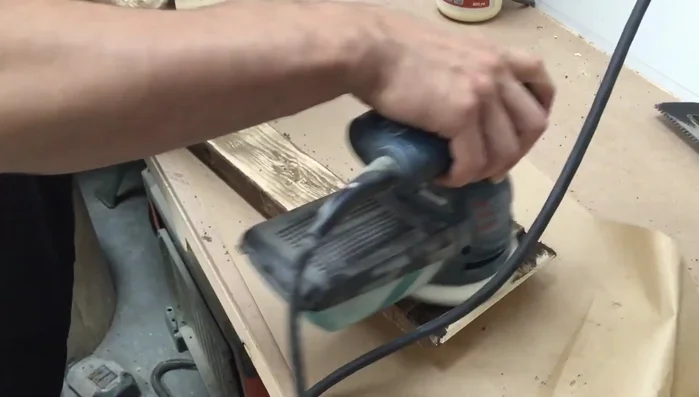 Sand off some of the stain with a random orbital sander and use a steel brush to texture the wood for a weathered look. Apply a Golden Oak stain for a two-toned effect.