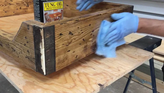 Apply three coats of tongue oil, using steel wool to work it into the wood after each coat.