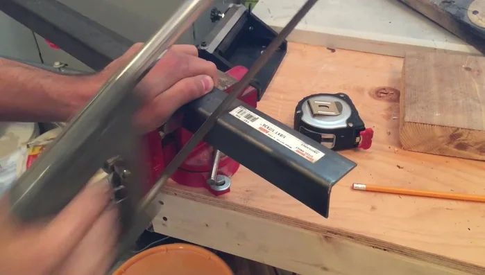 Tape off the corners and spray them with hammered black spray paint.