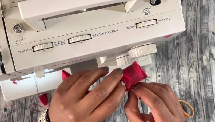 Add hot glue (optional): Apply hot glue to the center to prevent the small bow piece from sliding.