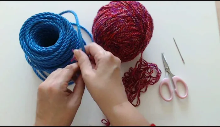 Using a needle, weave the yarn ends into the cat bed to secure them and create a snug shape.